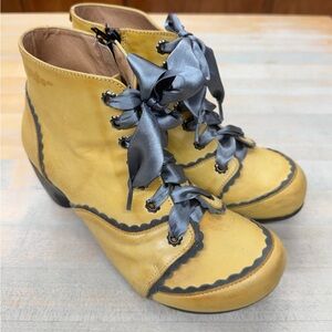 Step out in style with these chic yellow leather ankle boots